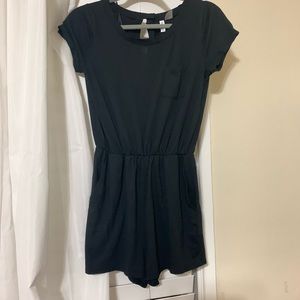 Black romper with a POCKET on the left side. :)